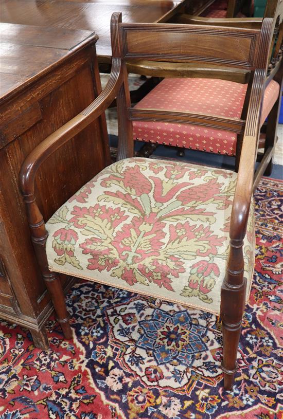 A pair of Regency mahogany open armchairs